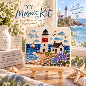 May include: A DIY mosaic kit featuring a square board with a lighthouse, a small house, a sailboat, and blue and brown glass pieces. The text reads DIY Mosaic Kit, Small Pieces Big Happiness, Create Something Beautiful, and Relax Craft Enjoy Shine.