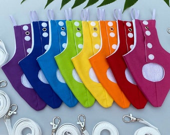 May include: A set of ten colorful fabric pet diapers with white snaps and a white trim. The diapers are arranged in a rainbow pattern. There are also five white leashes with silver clips.