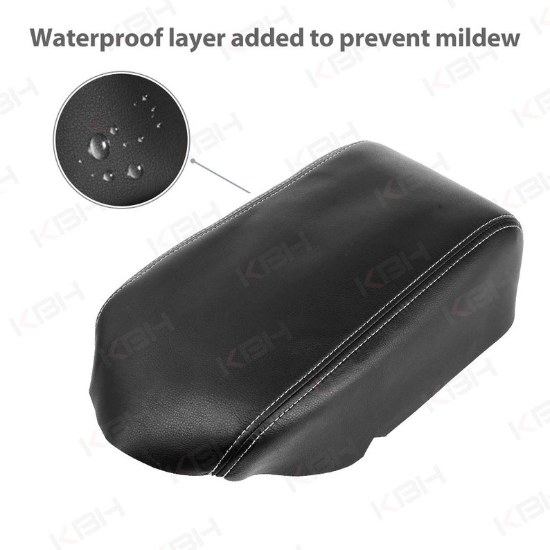 May include: Black car armrest cover with white stitching. The image includes a close-up showing a waterproof layer to prevent mildew. The text "Waterproof layer added to prevent mildew" is visible.