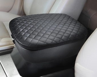 May include: Black quilted leather car armrest cover. The cover is designed to fit over the existing armrest and provides extra padding and comfort.