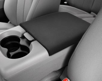 May include: Black car seat cover with two cup holders. The cover is made of a soft, durable material and is designed to protect your car seats from spills, stains, and wear and tear.