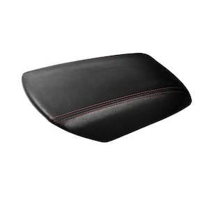 May include: Black leather centre console armrest cover with red stitching.