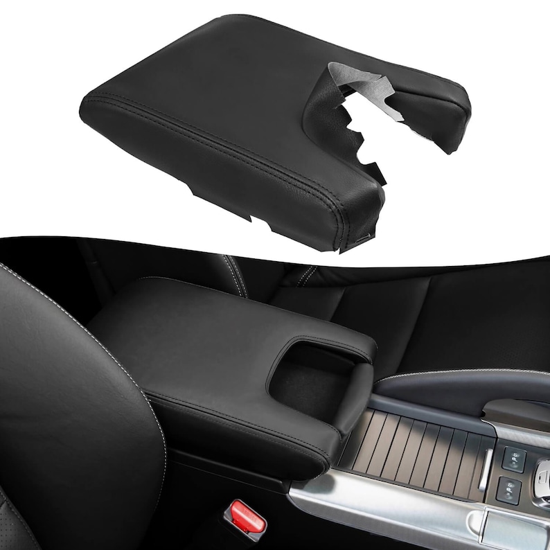 Puede incluir: Cubierta de reposabrazos de la consola central de cuero negro para un autom&oacute;vil. La cubierta tiene un compartimento de almacenamiento integrado con una tapa.