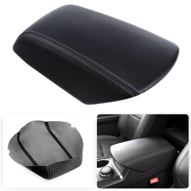 May include: Black center console lid with white stitching. The lid is rectangular with rounded edges. The image also shows a gray cover and a view of the lid installed in a vehicle.