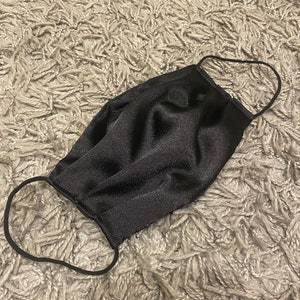 Super soft silky satin face masks made in the UK Washable and reusable. Comfortable fit with a very stylish look. Black