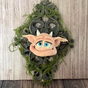 Pondering Pipsqueak Handcrafted Forest Imp Wall Decor. Bring a touch of the peculiar into your home with this ooak kind wall spirit