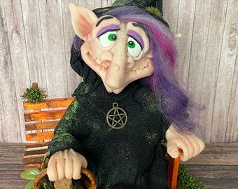 Witch on a park bench  figurine purple/black with witchy basket