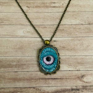 Dragon Eye Necklace Pendant - Featuring an antique bronze-coloured fitting, a mystical statement piece!