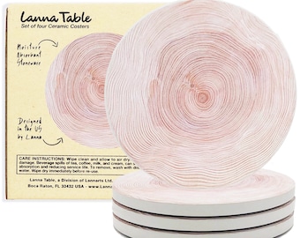 May include: Set of four white ceramic coasters with a wood grain design. The coasters are round and have a slightly raised edge. The coasters are packaged in a box with the text "Lanna Table" and "Set of four Ceramic Coasters".