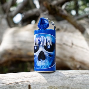 May include: Blue and white firework with a skull graphic and the text "Blue Storm".