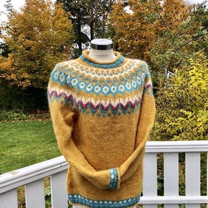 Yellow Icelandic sweater women Fair Isle hand knitted in Baby Alpaca Merino yarn with patterned yoke and cuffs in purple, teal and white colors.