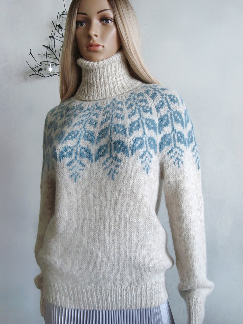 Beige sweater women's Fair Isle turtleneck hand knitted in Baby Alpaca Merino with blue round patterned joke.