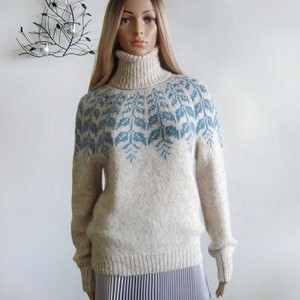 Beige sweater women's Fair Isle turtleneck hand knitted in Baby Alpaca Merino with blue round patterned joke.