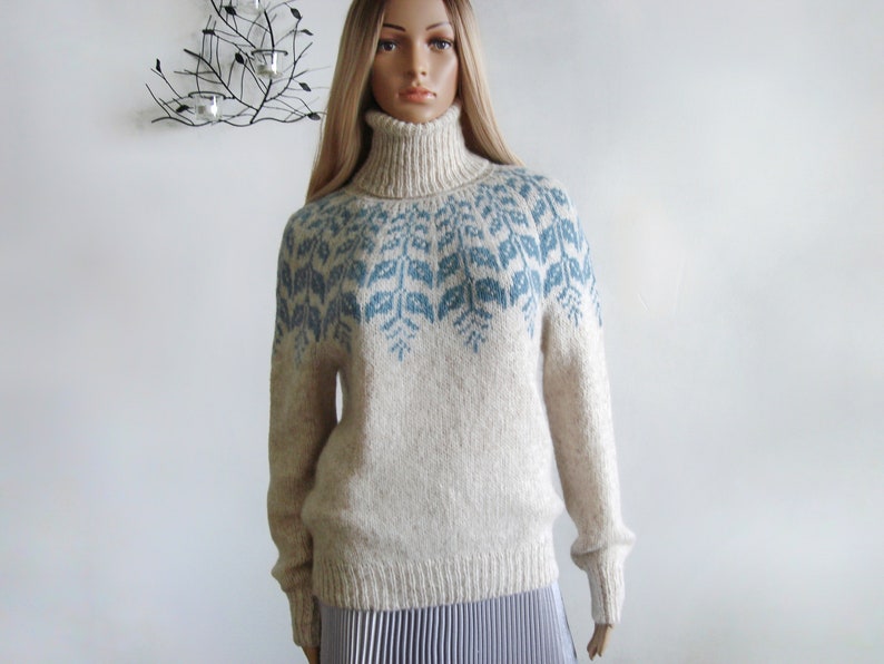 Beige sweater women's Fair Isle turtleneck hand knitted in Baby Alpaca Merino with blue round patterned joke.