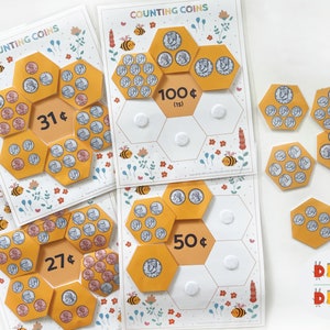 May include: A set of four printable counting coins activity sheets featuring a honeycomb design with bees and flowers. The sheets include different amounts of coins, with totals of 31 cents, 27 cents, 50 cents, and 100 cents.
