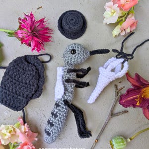 Crochet plague doctor amigurumi doll with beaked mask and dark fantasy style