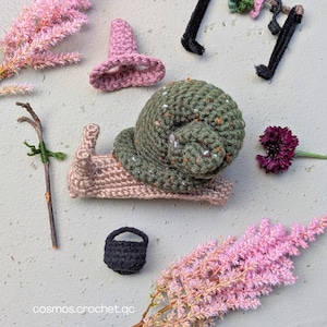 Handmade crochet snail character from fantasy insect amigurumi pattern