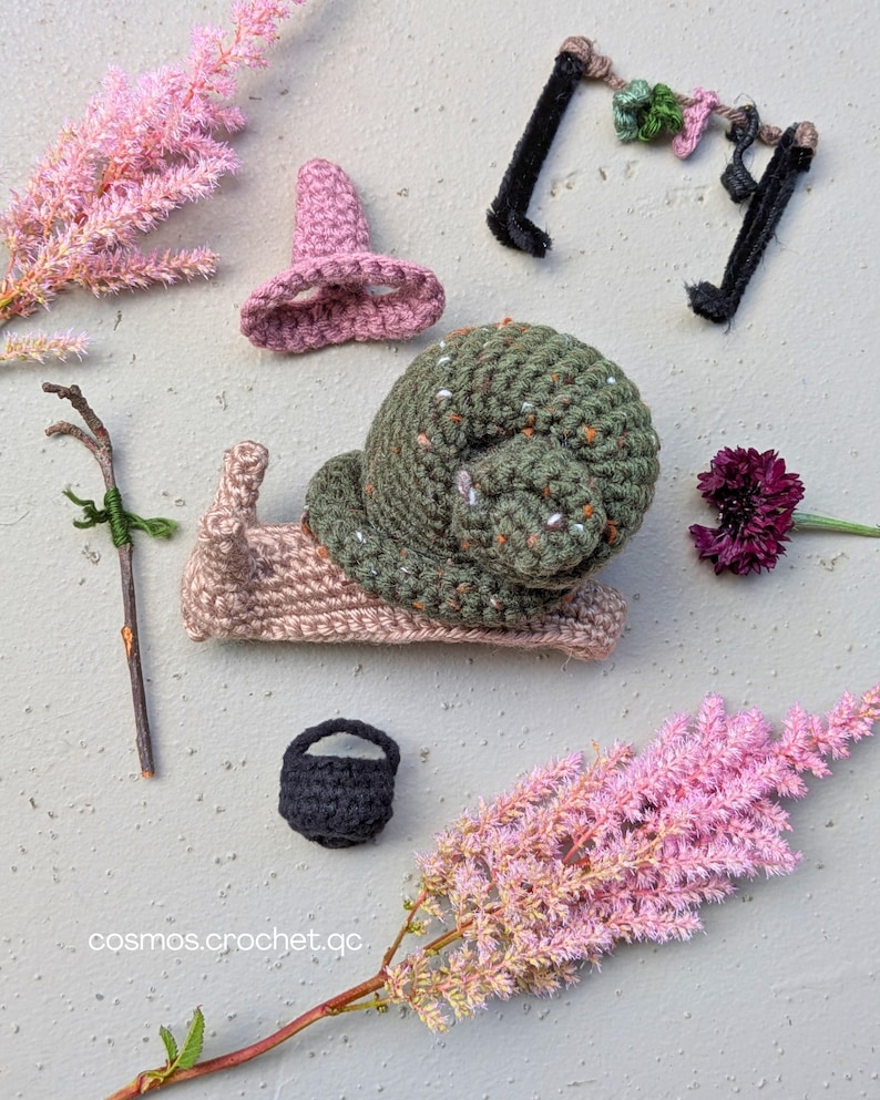 Handmade crochet snail character from fantasy insect amigurumi pattern