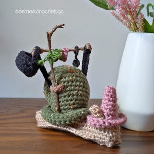 Crochet fantasy snail amigurumi character with detailed shell and soft yarn texture