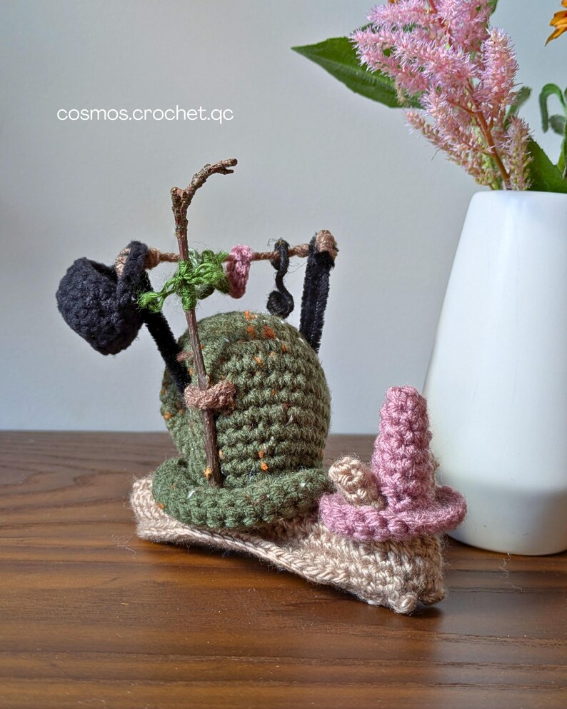 Crochet fantasy snail amigurumi character with detailed shell and soft yarn texture