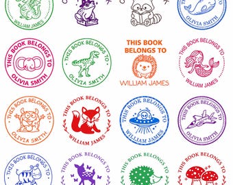 May include: A collection of sixteen circular rubber stamps featuring various illustrations including a dragon, frog, raccoon, whale, elephant, dinosaur, hedgehog, mermaid, monster, fox, UFO, jet, zebra, deer, and mushrooms with text like This Book Belongs To.