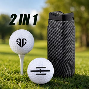 May include: A 2 IN 1 set featuring two white golf balls and a black carbon fiber patterned cylindrical container. One golf ball sits on a white tee and displays the letters SUG in a heart shape, while the other ball features a black horizontal line graphic.
