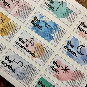 May include: A set of 10 colorful cards with watercolor backgrounds and black ink illustrations. Each card features a different symbol and the words "Witches Runes" and "The [name of the rune]".