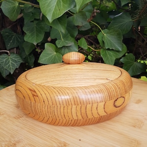 handmade can made of beech glued wood, turned