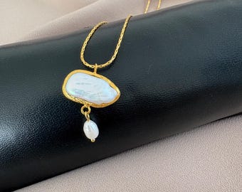 Collana con ciondolo a conchiglia in oro rosa 14 carati con