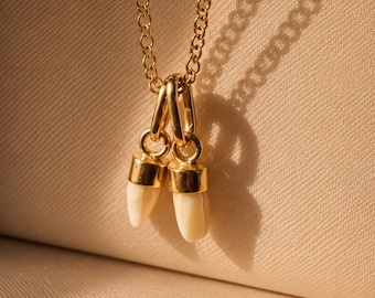 Pair of 2 Antique 18K gold milk teeth pendant