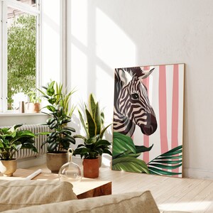May include: A black and white zebra illustration with pink and white stripes in the background. The zebra is looking to the right and has a green leafy plant in the foreground.