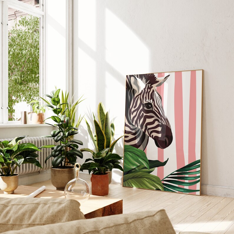 May include: A black and white zebra illustration with pink and white stripes in the background. The zebra is looking to the right and has a green leafy plant in the foreground.