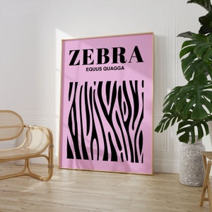 May include: A pink and black zebra print poster with the text "ZEBRA" and "EQUUS QUAGGA" in black.