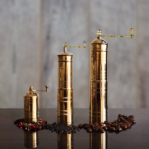 Salt and pepper store grinders with handles