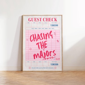 May include: A pink and blue guest check with the text "CHASING THE MAJORS" in pink and blue. The check number is 138336 and the total is £26.20. The text "PLEASE COME AGAIN AFTER NEXT LONG RUN." is at the bottom of the check.