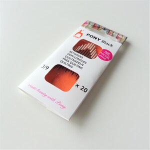 May include: A package of 20 black quilting needles, size 3/9, by Pony. The needles are not nickel plated. The package is white with orange accents and the text "PONY Black" in black.
