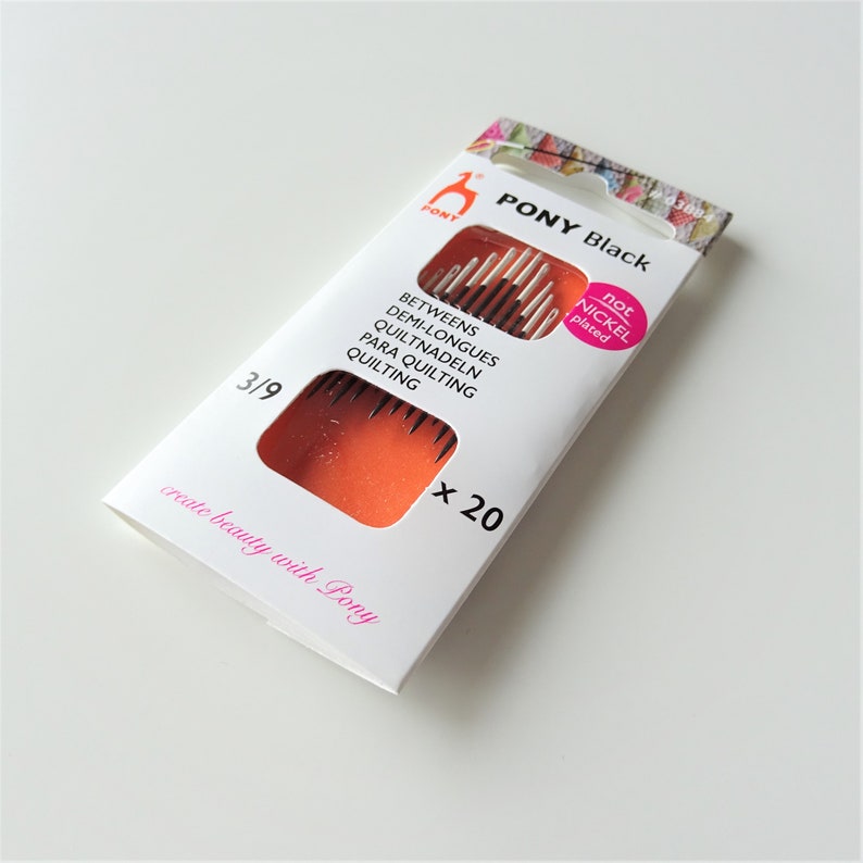 May include: A package of 20 black quilting needles, size 3/9, by Pony. The needles are not nickel plated. The package is white with orange accents and the text "PONY Black" in black.