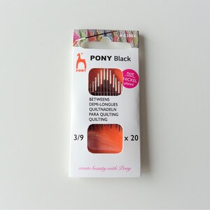 May include: A package of 20 black quilting needles, size 3/9, by PONY. The needles are not nickel plated. The package is orange and white with the text "PONY Black" and "create beauty with Pony".