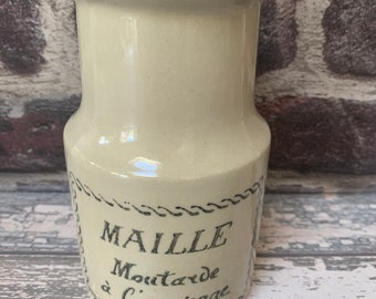 May include: A white ceramic jar with a black label that reads "MAILLE Mustard a l'ancienne".
