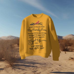 May include: A yellow sweatshirt with a black graphic print of a cardinal bird on a branch. The text reads "A limb has fallen from our family tree that says grieve not for me. Remember the best times, the laughter, the song, the good life I lived when I was strong."