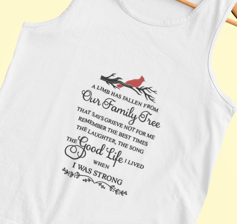 May include: White tank top with a black and red graphic design. The graphic features a cardinal bird on a branch with the text "A limb has fallen from our family tree that says grieve not for me remember the best times the laughter, the song the good life I lived when I was strong."