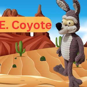 May include: A crocheted Wile E. Coyote plush toy stands in a desert landscape. The coyote is brown and white with a long snout and large ears. The background features red rock formations and cacti.