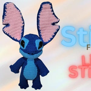 May include: A blue and pink crocheted Stitch plush toy with large ears. The toy is standing on a white background with the text "Stitch From Lila Stitches" in pink and blue.