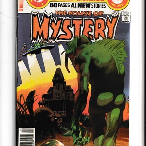 May include: A white ceramic mug with a black handle and the text "But First, Coffee" in a black, handwritten-style font. The mug is on a white surface.