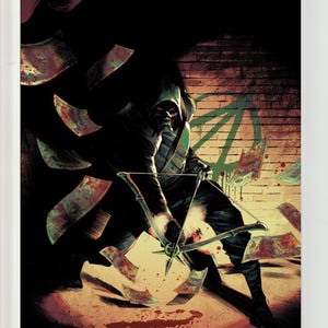 May include: A comic book cover featuring a hooded figure in a dark suit holding a bow and arrow. The figure is surrounded by floating, blood-stained paper currency against a brick wall with a green symbol. The DC logo is in the top left corner.