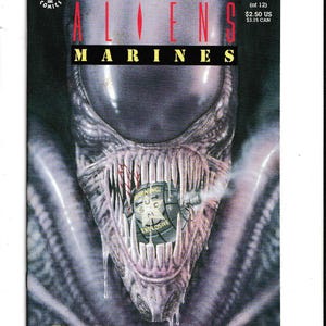 May include: Comic book cover for "Colonial Marines" #1, featuring a close-up of an alien's head with sharp teeth and dripping saliva. The title is in bold, red and white letters. The cover includes the Dark Horse Comics logo.