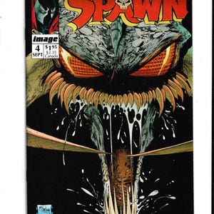 May include: Spawn comic book cover featuring a grotesque, monstrous face with glowing orange eyes and sharp teeth. The title "SPAWN" is in large, red letters. The comic book is labeled "Image 4" and "Sept".