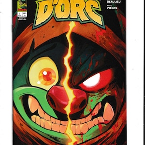 May include: Comic book cover featuring a split face of a green and red creature with large teeth and glowing eyes. The title "D'ORC" is in large yellow letters. The cover includes the text "HALF DWARF, HALF ORC, ALL..." and the names of the creators.