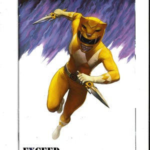 May include: A comic book cover featuring the Yellow Power Ranger in a dynamic action pose, wearing a yellow and white suit with a feline helmet, holding two daggers against a purple and white background with the text EXCEED EXCLUSIVES.
