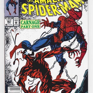 May include: Comic book cover featuring Spider-Man in a red and blue suit battling a red villain named Carnage. The cover has the text "The Amazing Spider-Man" and "Carnage Part One". The background is white with black accents.